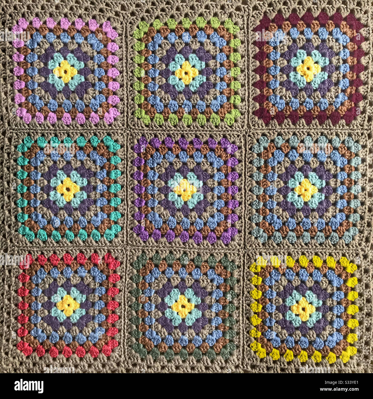 Granny square crocheted baby blanket. - Smartphone Captured Stock Image