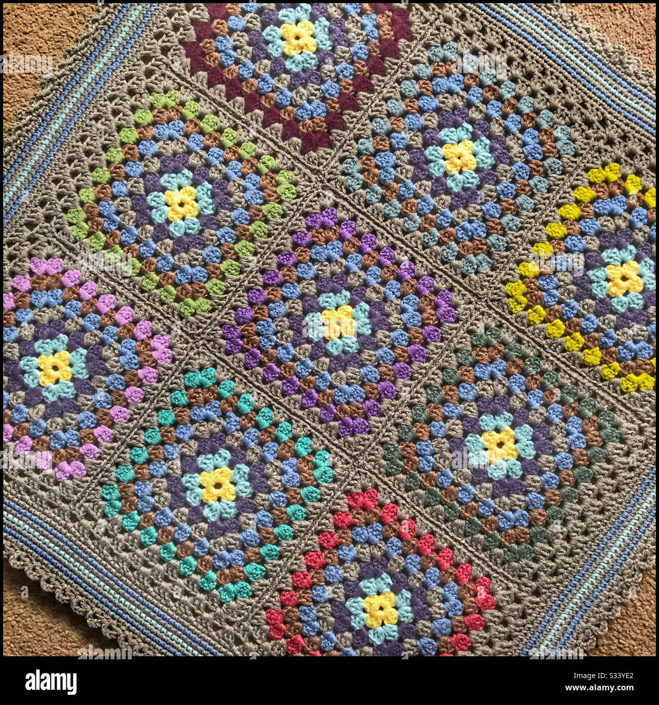 Granny square crocheted baby blanket. - Smartphone Captured Stock Image