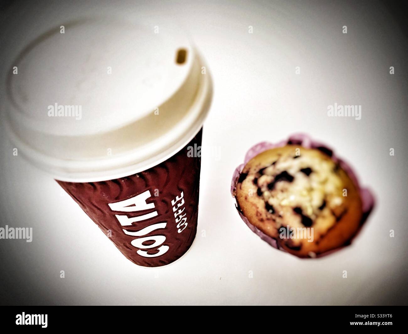 Take away Costa coffee and blueberry muffin - Smartphone Captured Stock Image