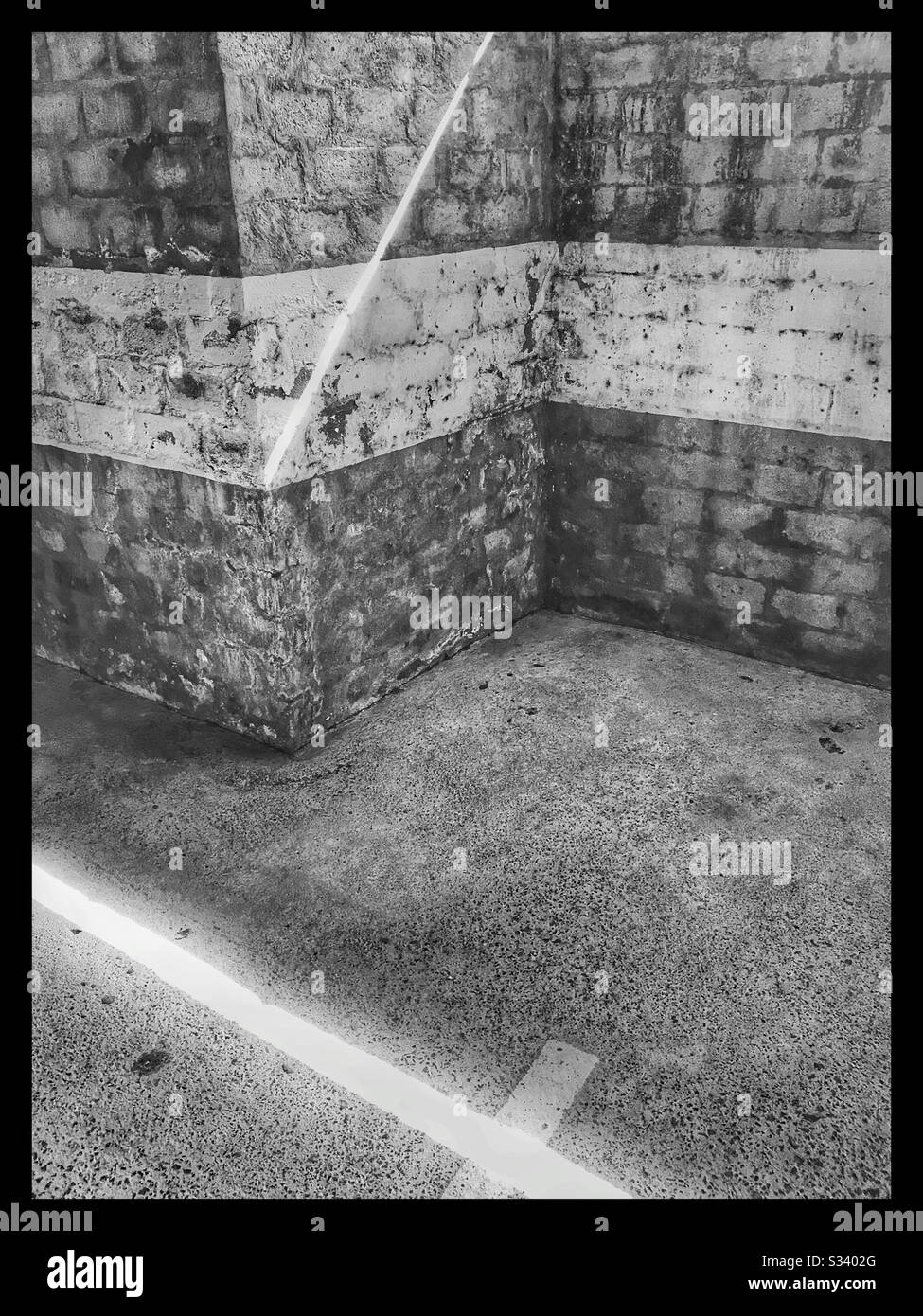 Black and white photo of abstract lines in parking garage. - Smartphone Captured Stock Image