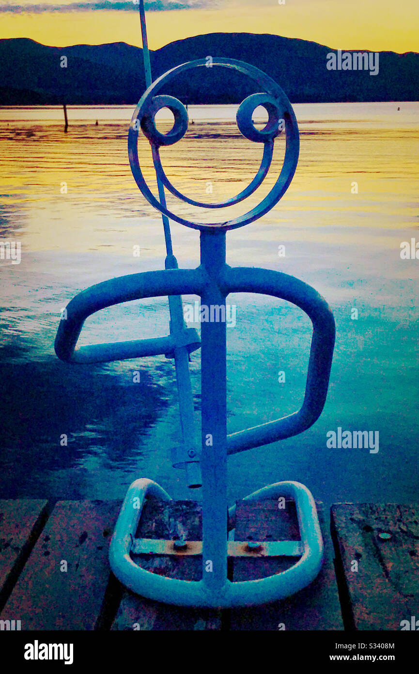 Fisherman sculpture at Duck Bay Marina on Loch Lomond, Scotland. - Smartphone Captured Stock Image