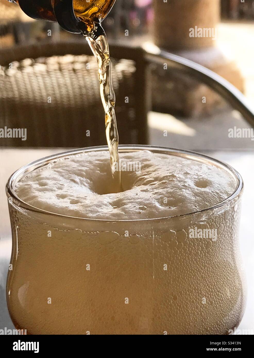 Pouring beer in a glass. - Smartphone Captured Stock Image