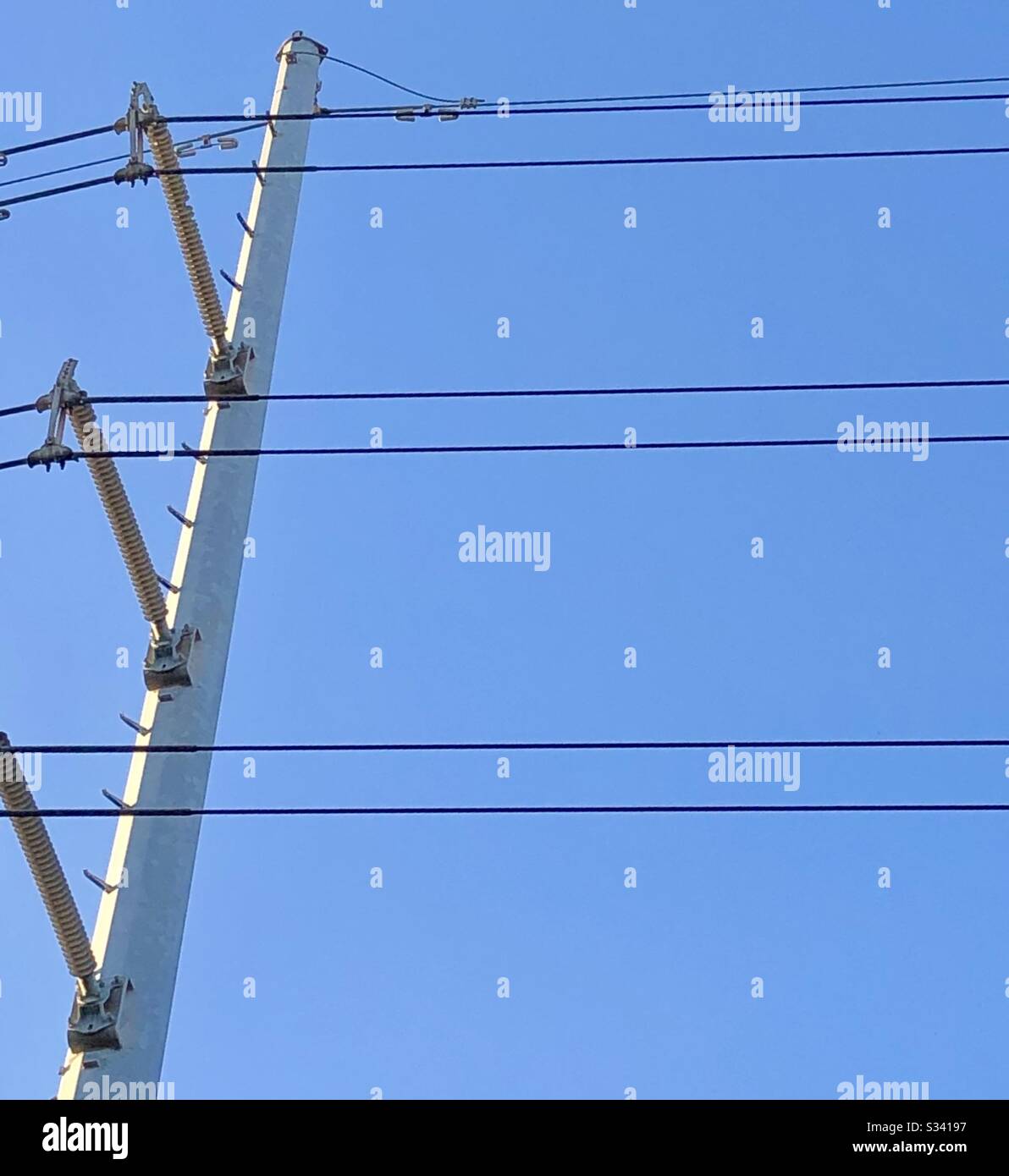 High voltage Electrical wires and pole on a clear sunny day Stock Photo Alamy