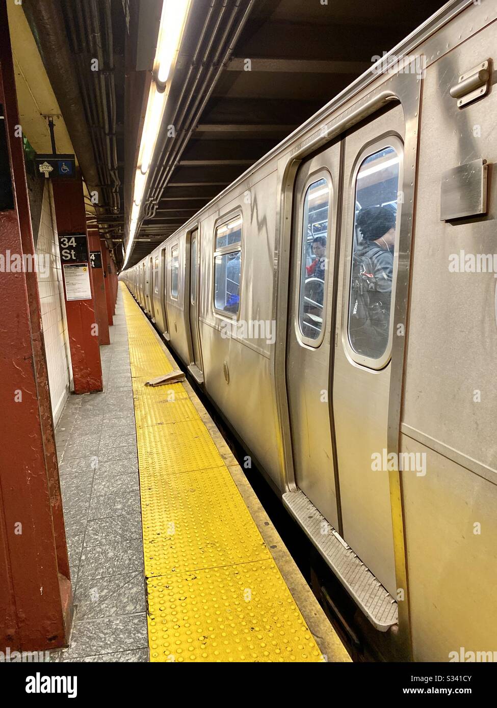 New York City subway train leaving the station. - Smartphone Captured Stock Image