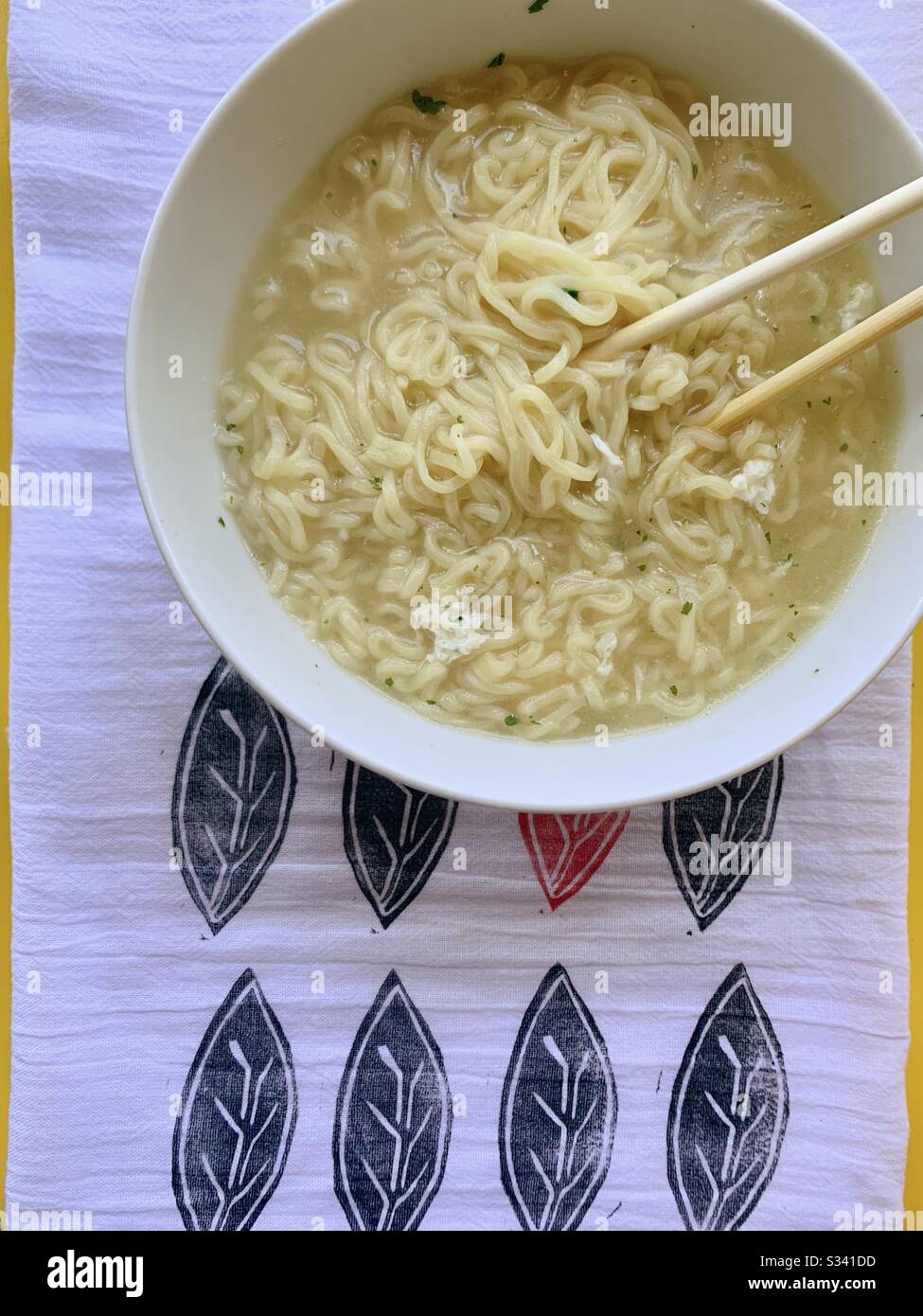 Hot cooked ramen noodles in a bowl with chopsticks - Smartphone Captured Stock Image