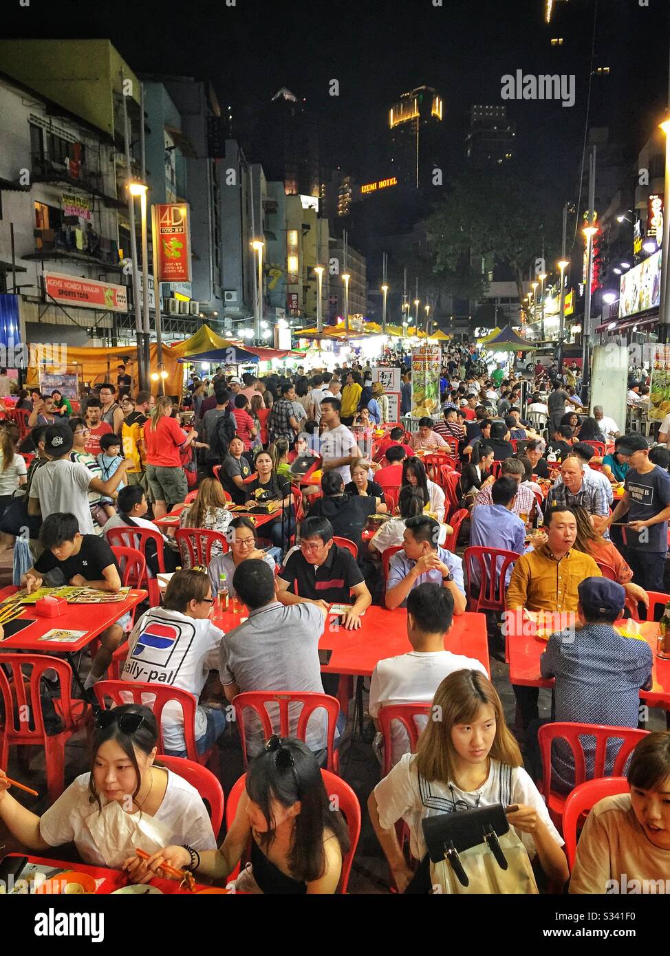 Outdoor restaurants in Jalan Alor, a hawker food market in Bukit Bintang, Kuala Lumpur, Malaysia - Smartphone Captured Stock Image