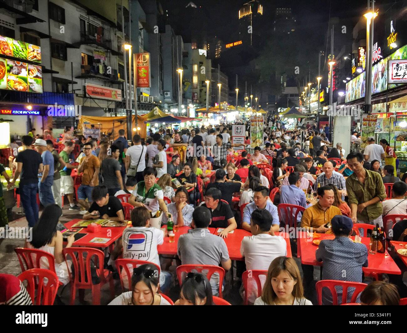 Outdoor restaurants in Jalan Alor, a hawker food market in Bukit Bintang, Kuala Lumpur, Malaysia - Smartphone Captured Stock Image
