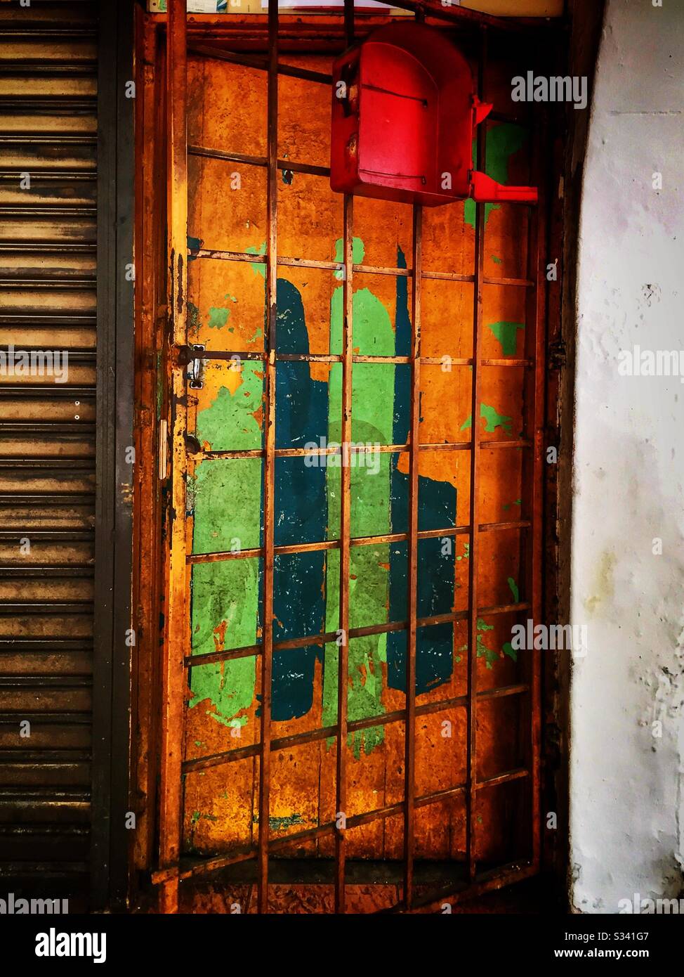 Painted door and security gate, Kuala Lumpur, Malaysia - Smartphone Captured Stock Image