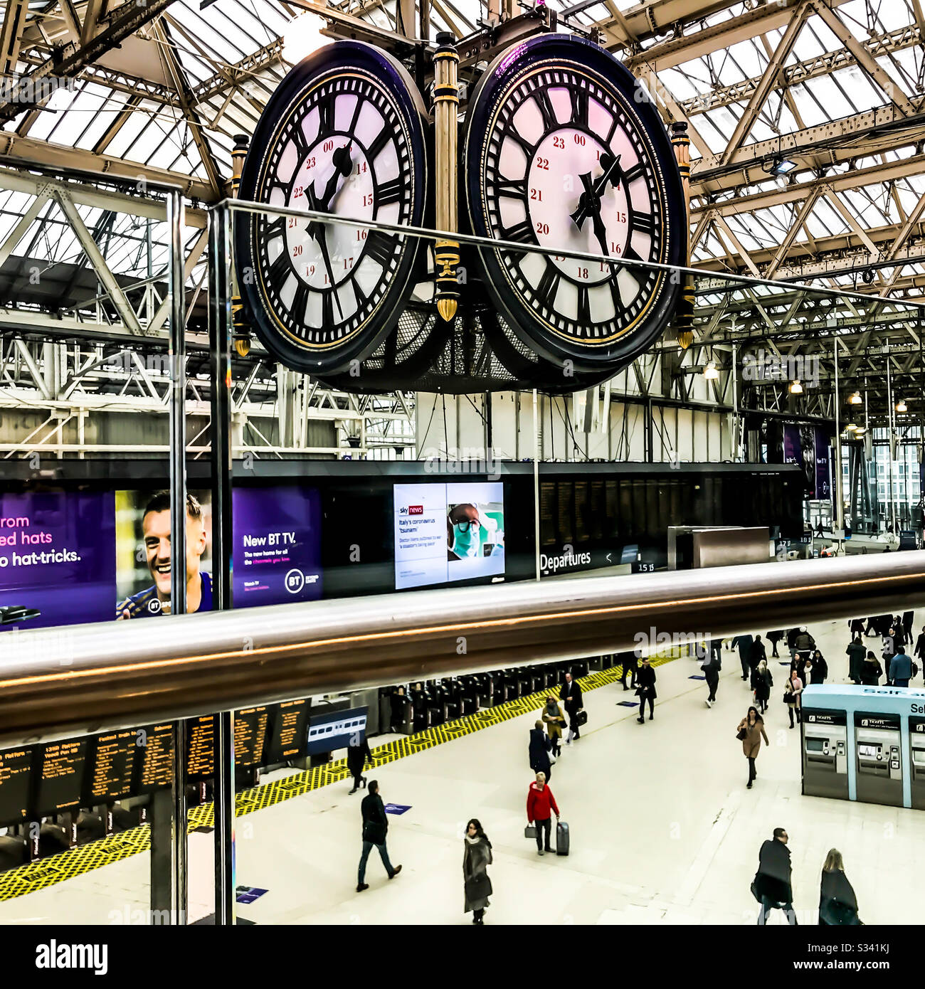 The four faced clock at Waterloo Station London above the main  concourse Stock Photo