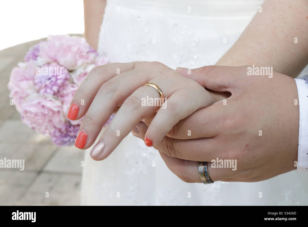 Hands holding married wedding bouquet Stock Photo