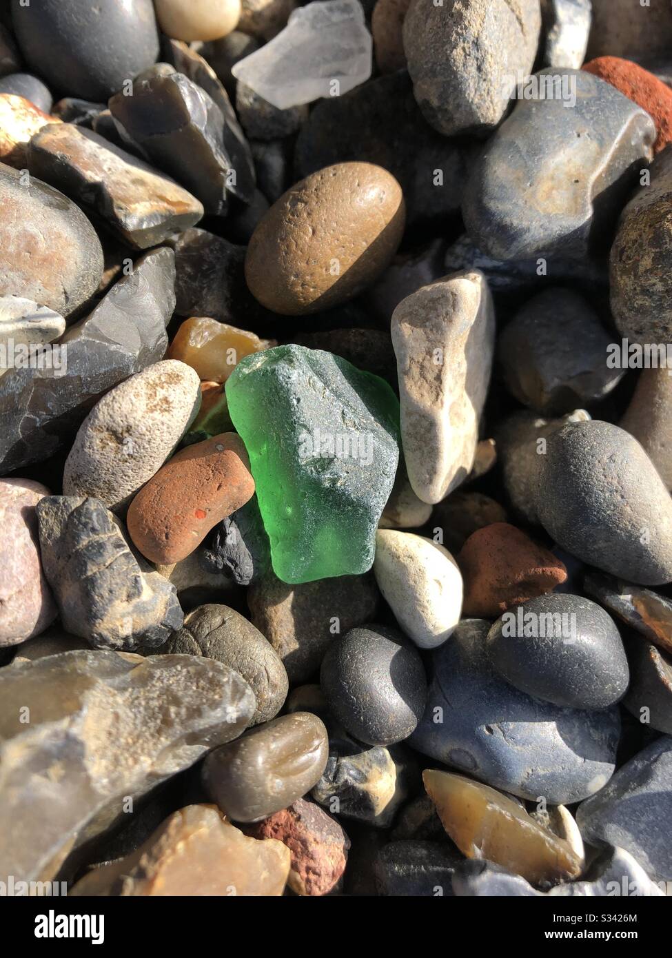 Emerald green river glass found Thames River London at low tide Stock Photo