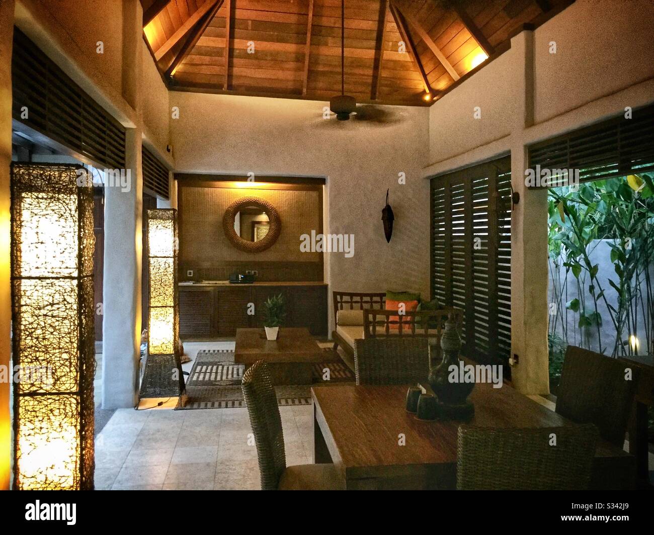 The al fresco lounge and dining area of a Garden Villa at The Banjaran Hotsprings Retreat near Ipoh, Malaysia - Smartphone Captured Stock Image