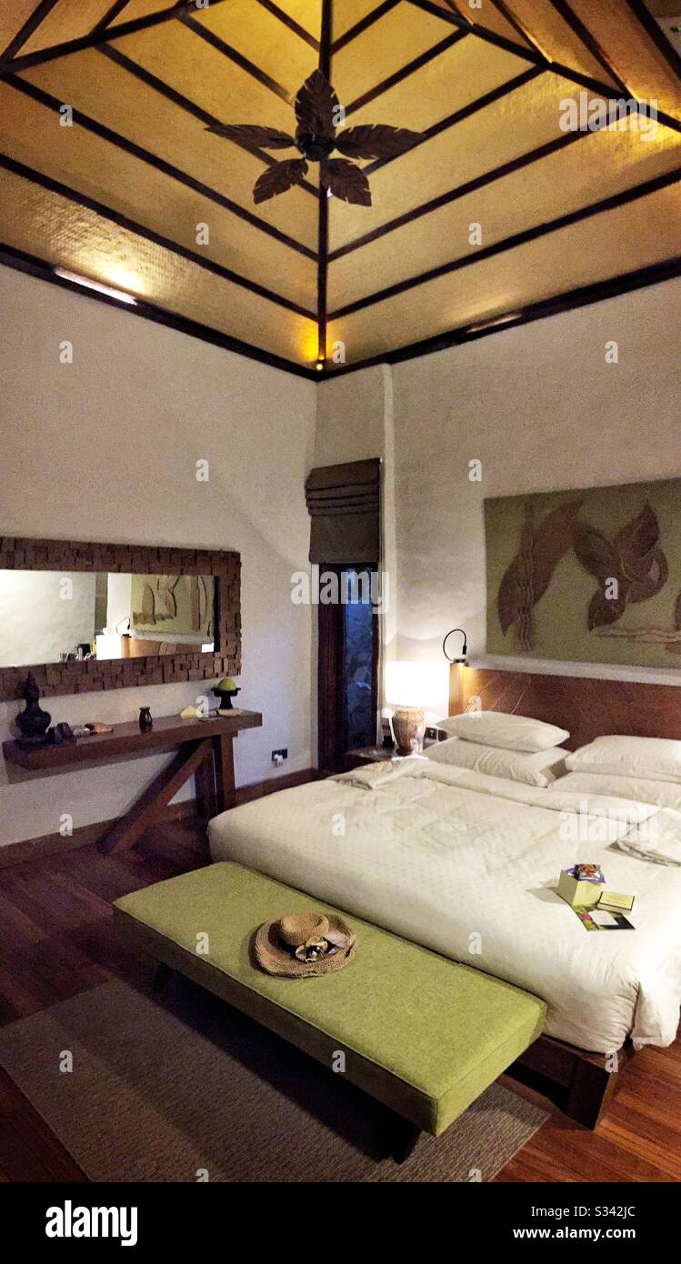 The bedroom of a Garden Villa at The Banjaran Hotsprings Retreat near Ipoh, Malaysia - Smartphone Captured Stock Image