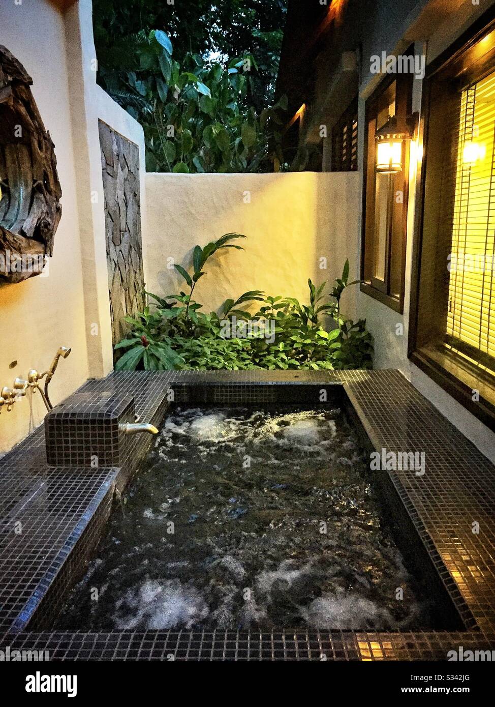 The private spa pool, using geothermal water from the hotsprings in the resort, in a Garden Villa at The Banjaran Hotsprings Retreat near Ipoh, Malaysia - Smartphone Captured Stock Image