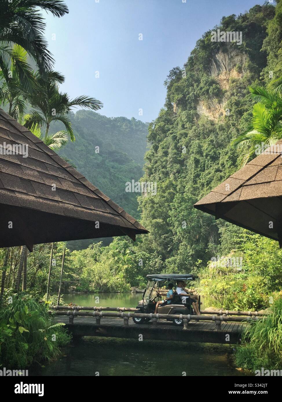 The man-made lake fed by geothermal hotsprings and the spectacular limestone karst landscape at The Banjaran Hotsprings Retreat near Ipoh, Malaysia Stock Photo