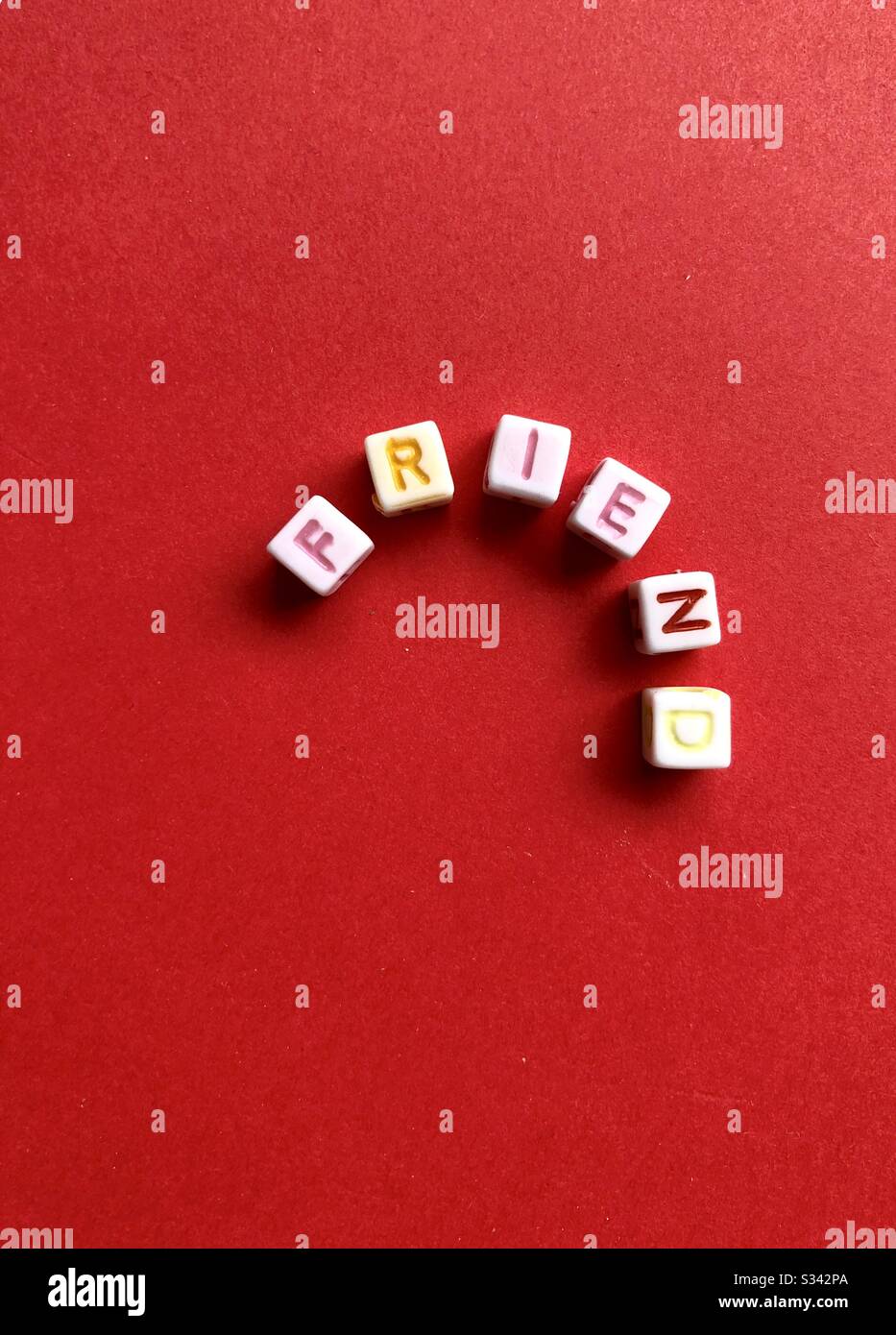 Letter cubes spelling out the word, friend - Smartphone Captured Stock Image