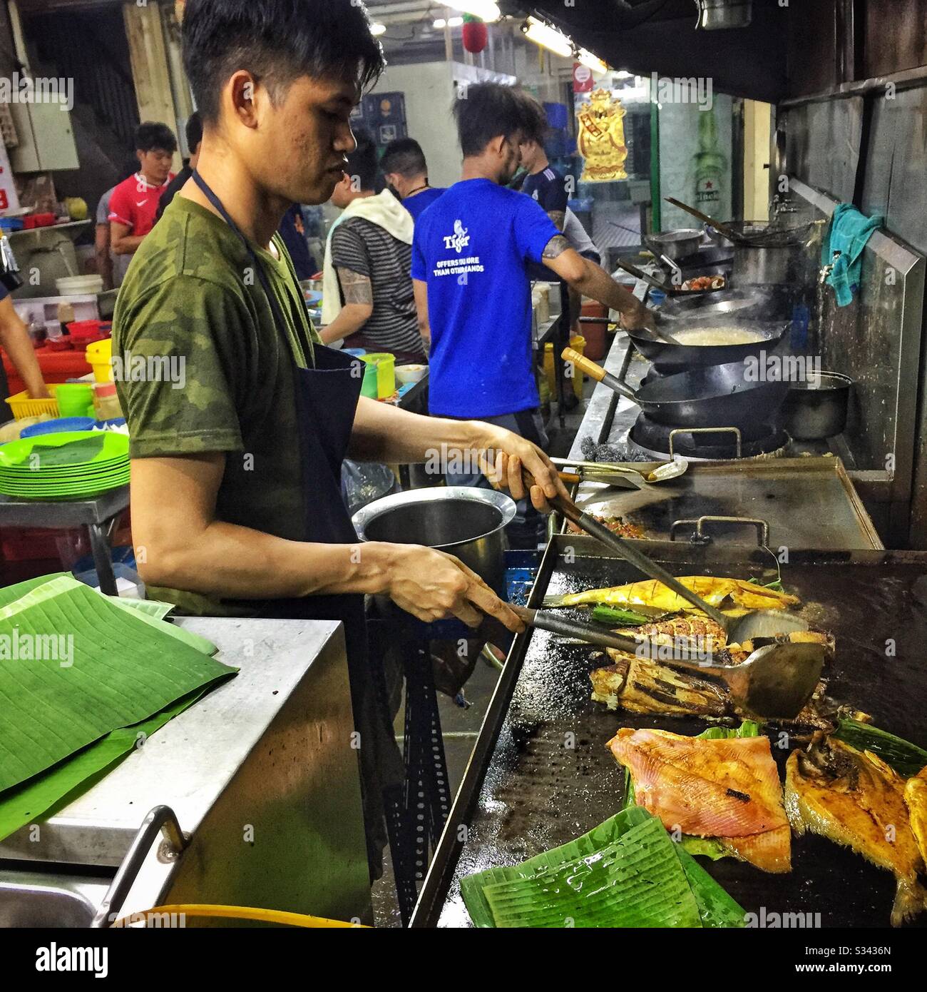 The kitchen of a street restaurant in Jalan Alor, a hawker food market in Bukit Bintang, Kuala Lumpur, Malaysia - Smartphone Captured Stock Image