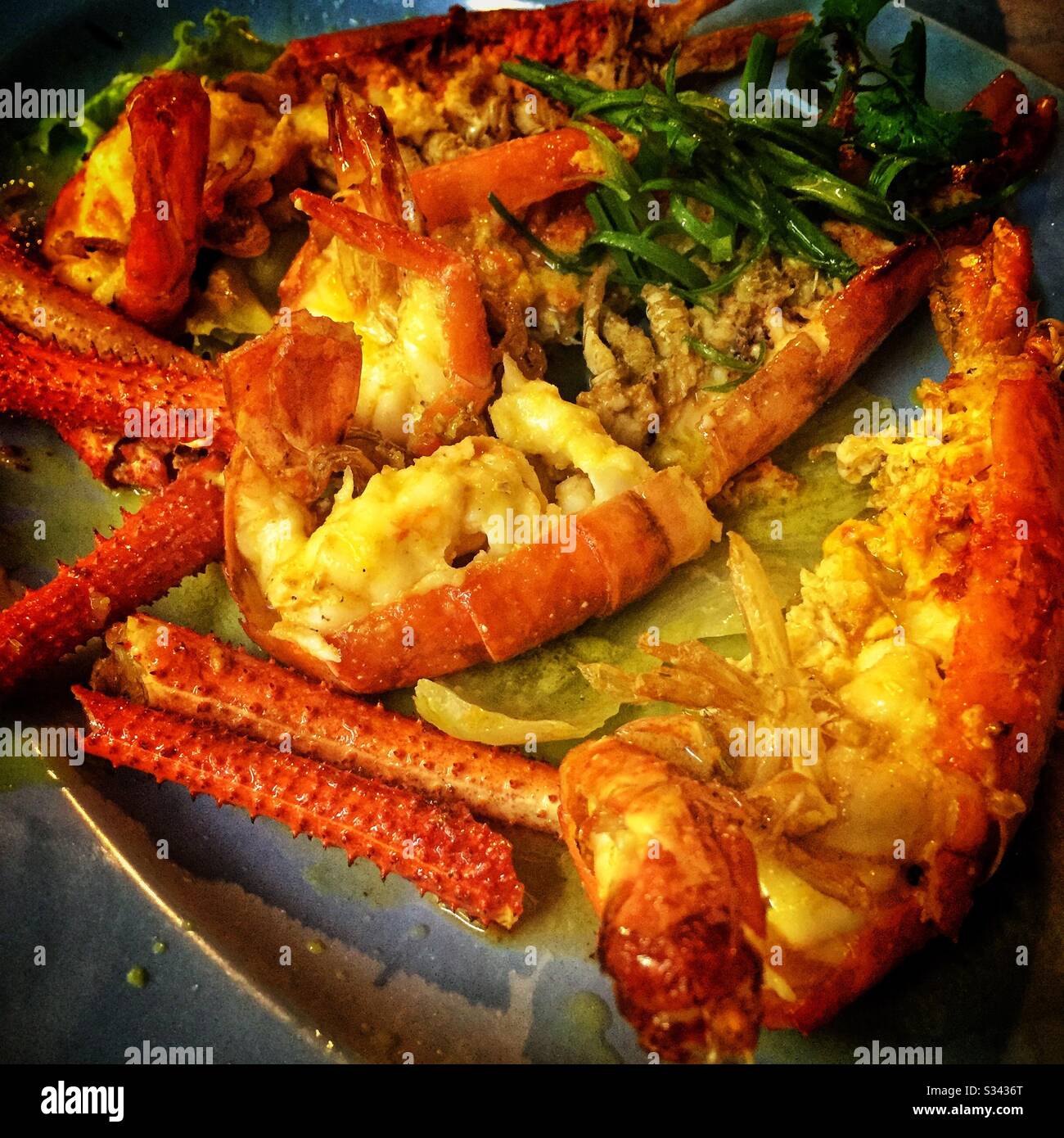 Grilled lobster at a street restaurant in Jalan Alor, a hawker food market in Bukit Bintang, Kuala Lumpur, Malaysia - Smartphone Captured Stock Image