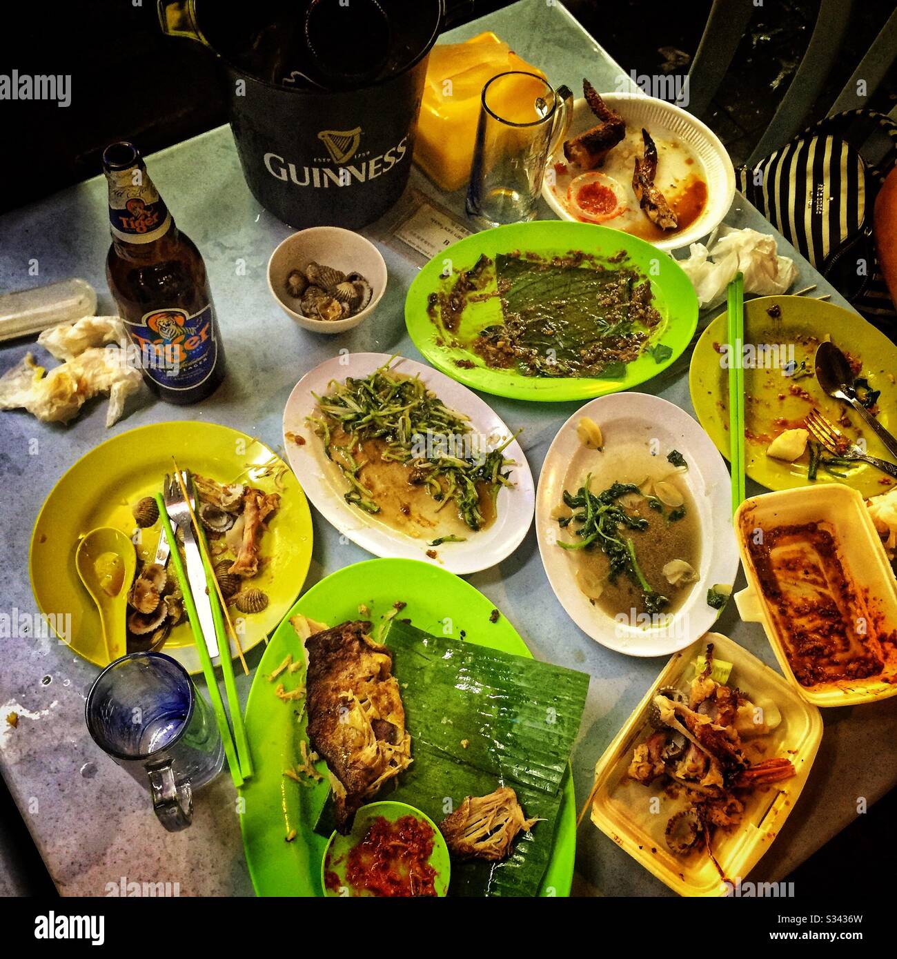 Aftermath of a meal at a street restaurant in Jalan Alor, a hawker food market in Bukit Bintang, Kuala Lumpur, Malaysia - Smartphone Captured Stock Image