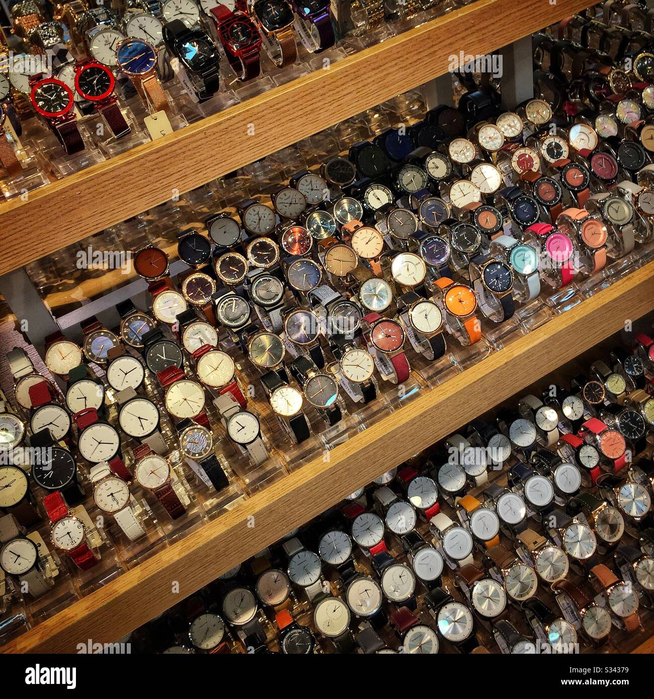 Watches for sale in a shop in Jalan Alor, a hawker food market in Bukit Bintang, Kuala Lumpur, Malaysia - Smartphone Captured Stock Image