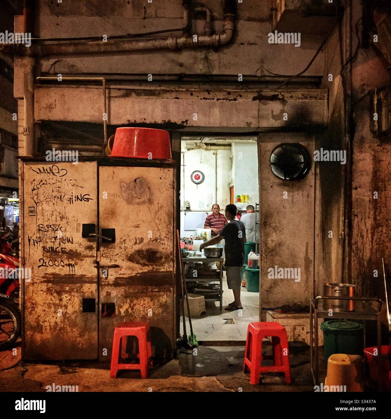 The kitchen of a street restaurant in Jalan Alor, a hawker food market in Bukit Bintang, Kuala Lumpur, Malaysia - Smartphone Captured Stock Image