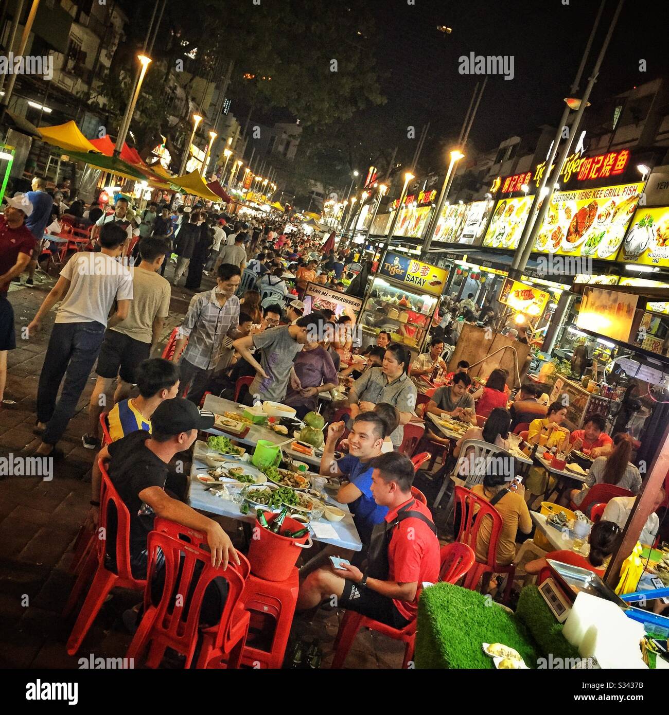Outdoor restaurants in Jalan Alor, a hawker food market in Bukit Bintang, Kuala Lumpur, Malaysia - Smartphone Captured Stock Image