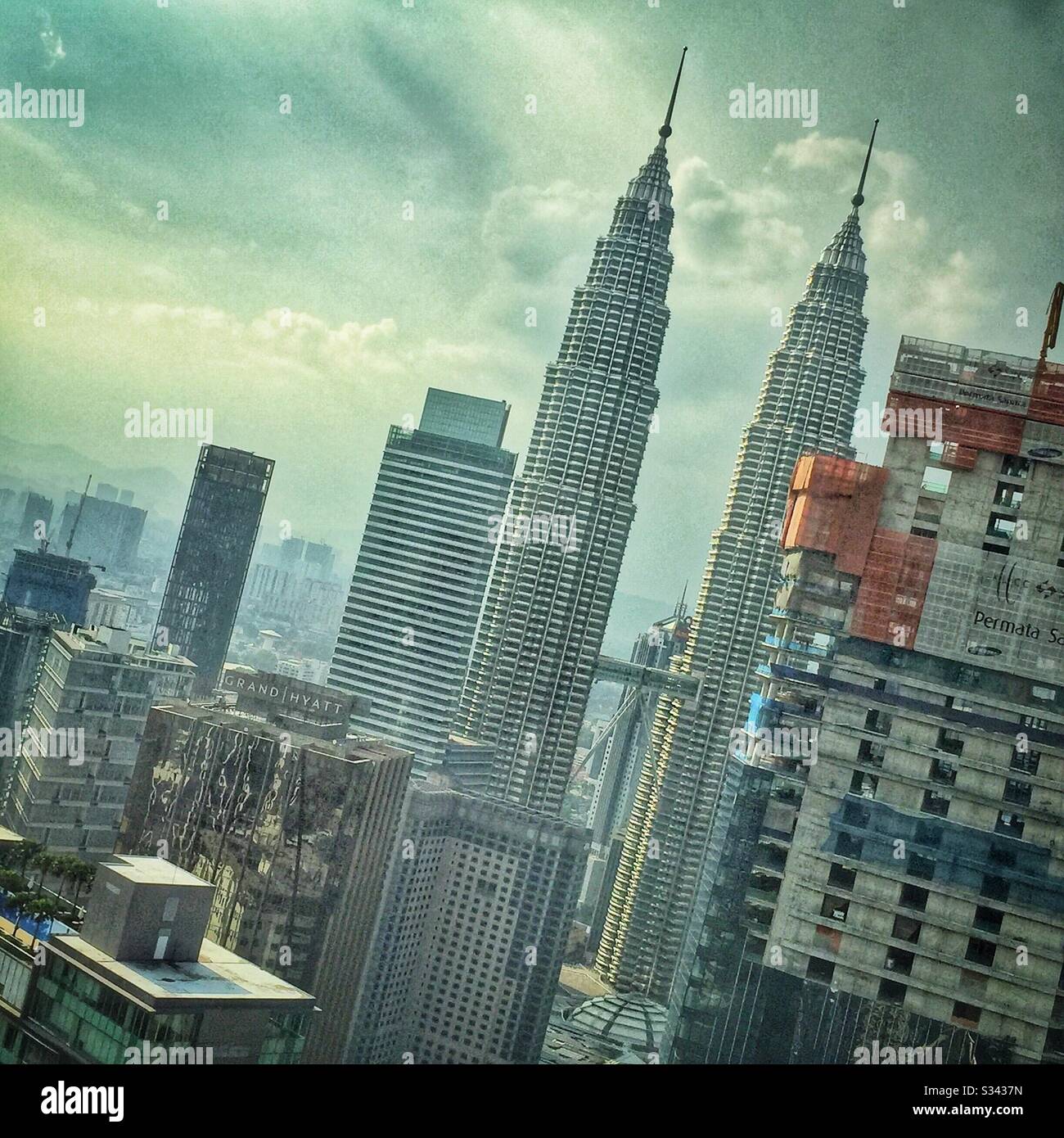 The Petronas Twin Towers and Kuala Lumpur city centre seen from Altitude, a bar on level 53 of the Banyan Tree, Malaysia - Smartphone Captured Stock Image