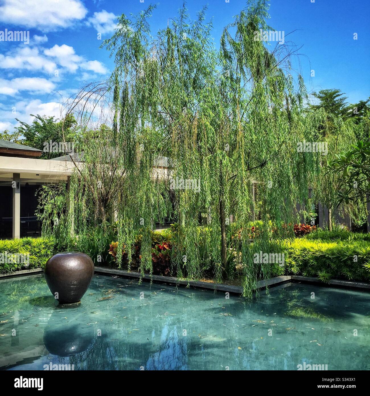 Ponds and water features aid cooling at Mangala Resort and Spa, Gambang, Kuantan, Pahang, Malaysia - Smartphone Captured Stock Image