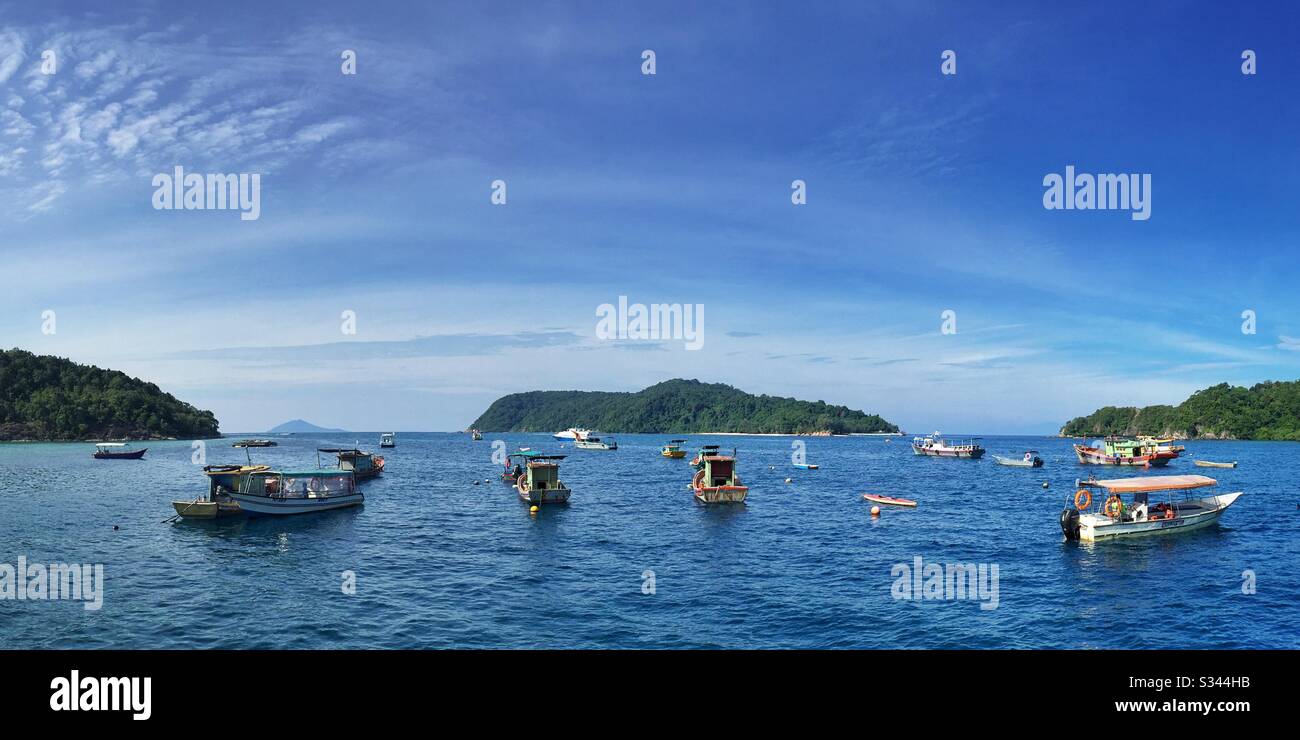 Traditional fishing boats moored in the sheltered harbour of Pulau Redang (Redang Island), Terengganu, Malaysia Stock Photo