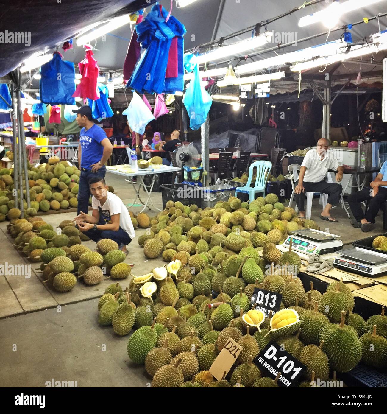 Durian for sale at a night street market in Kuala Terengganu, Malaysia - Smartphone Captured Stock Image