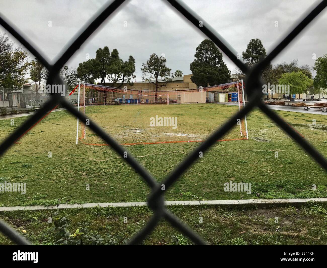 Empty soccer field on a rainy afternoon. Stock Photo