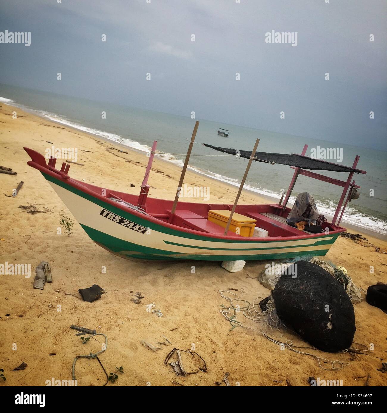 A traditional fishing boat and nets on the beach, Batu Rakit, Terengganu,  Malaysia Stock Photo - Alamy
