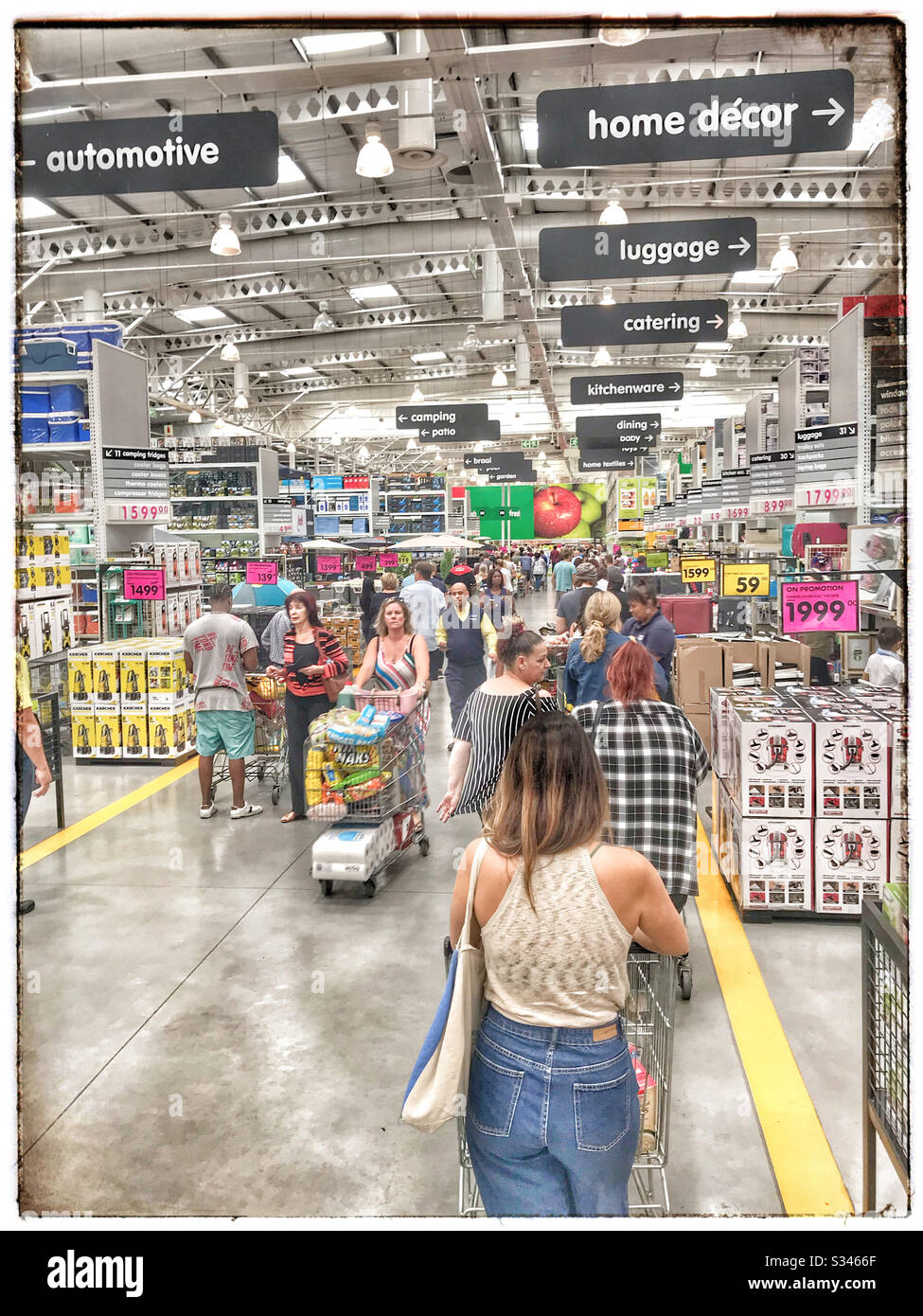 Customers stocking up on essentials during Corona virus pandemic. - Smartphone Captured Stock Image