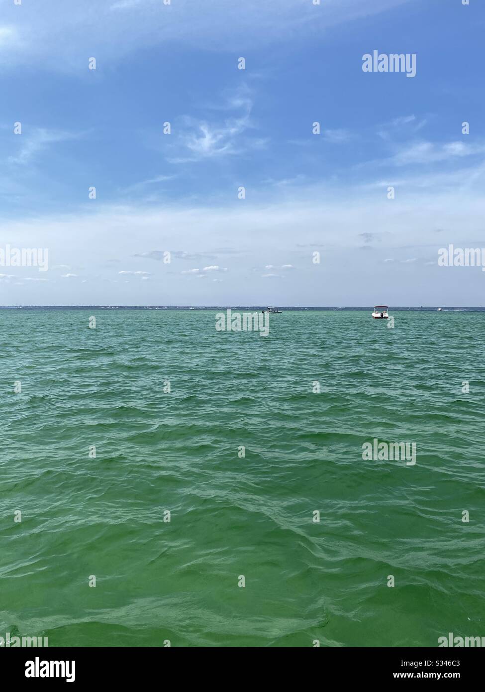 Boating on the bright emerald waters of the Gulf of Mexico - Smartphone Captured Stock Image