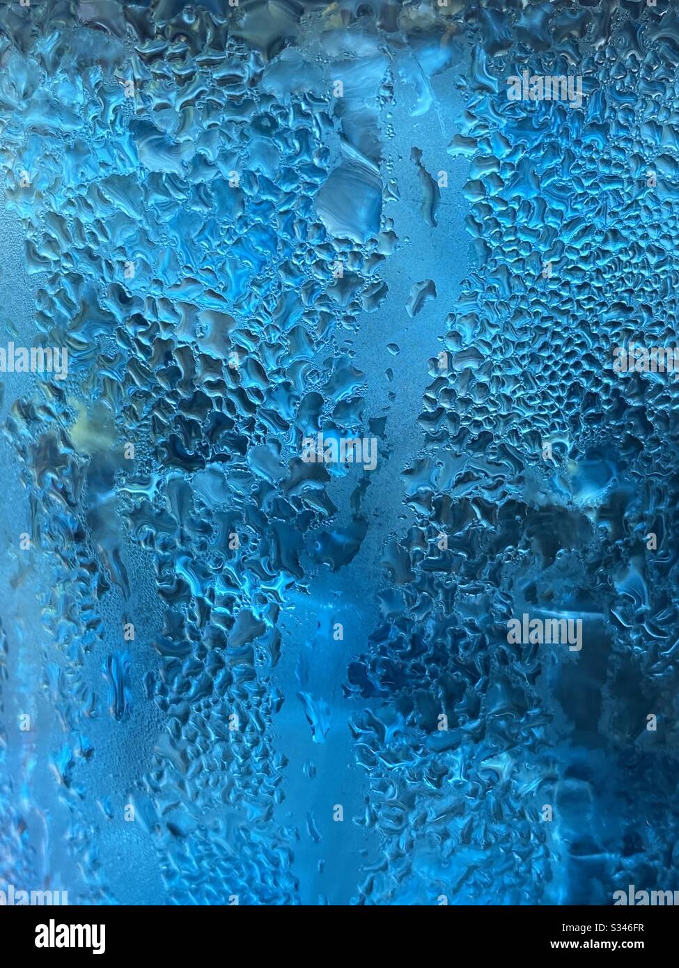 Abstract of condensation beads on blue water - Smartphone Captured Stock Image
