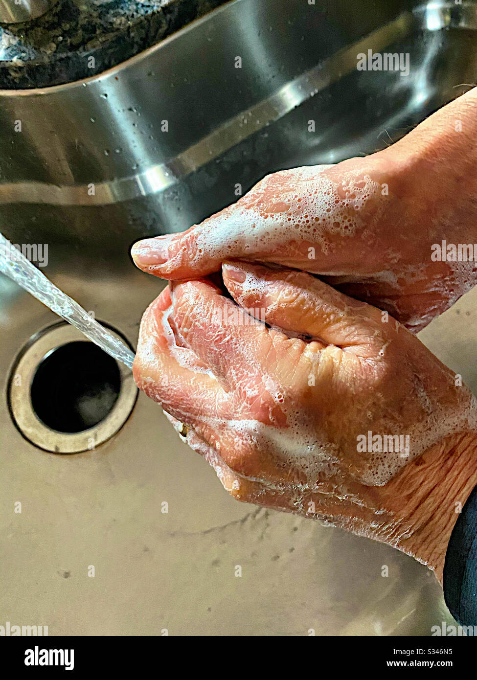 Man washing hands 2 - Smartphone Captured Stock Image