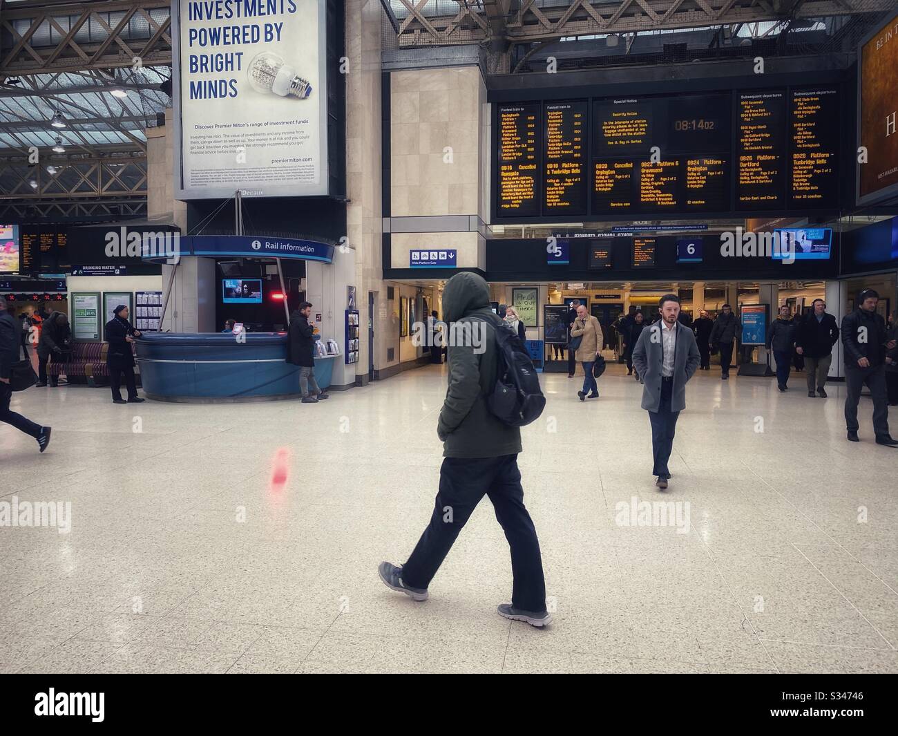 Charing Cross station seen during what is normally rush hour, the station is very quiet due to the COVID-19 outbreak on March 17 2020 - Smartphone Captured Stock Image