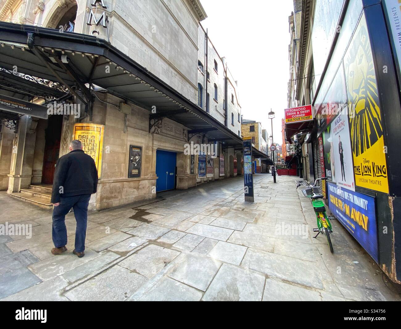 London’s west end during what would normally be a busy rush hour. The streets are very quiet and Theatrical productions have halted due to the COVID-19 outbreak on March 17 2020 - Smartphone Captured Stock Image