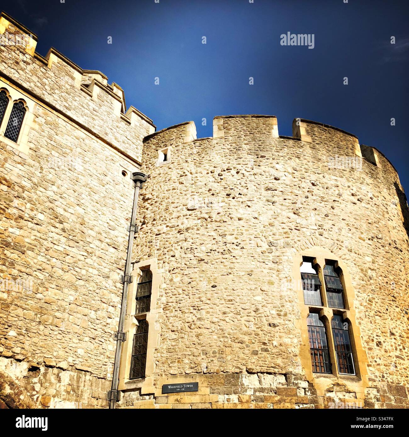Medieval architecture at the Tower of London. Royal castle and fortress complex within Tower Hamlets. UNESCO World Heritage Site. - Smartphone Captured Stock Image