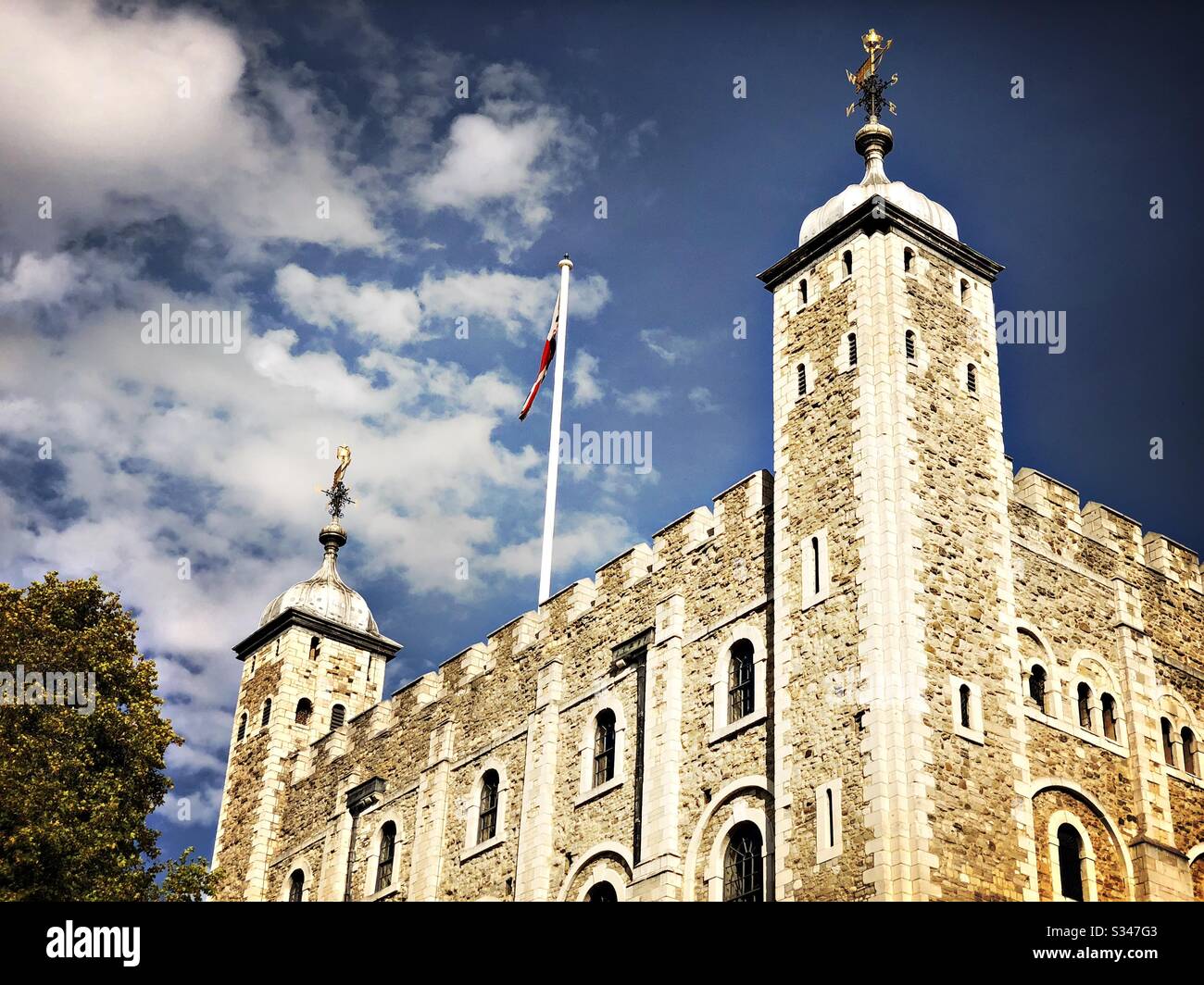 A low angle view of the White Tower keep within the Tower of London. Royal castle and fortress complex within Tower Hamlets. UNESCO World Heritage Site. - Smartphone Captured Stock Image
