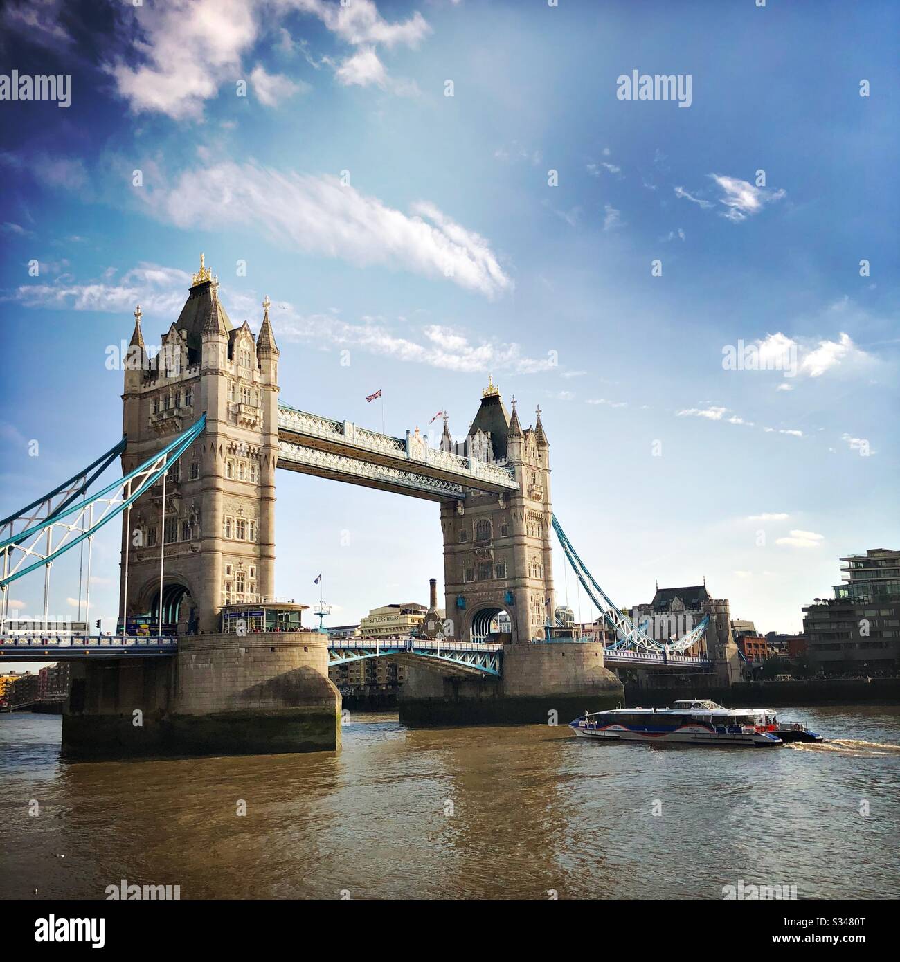 A river cruise boat approaching Tower Bridge on the River Thames, London - Smartphone Captured Stock Image