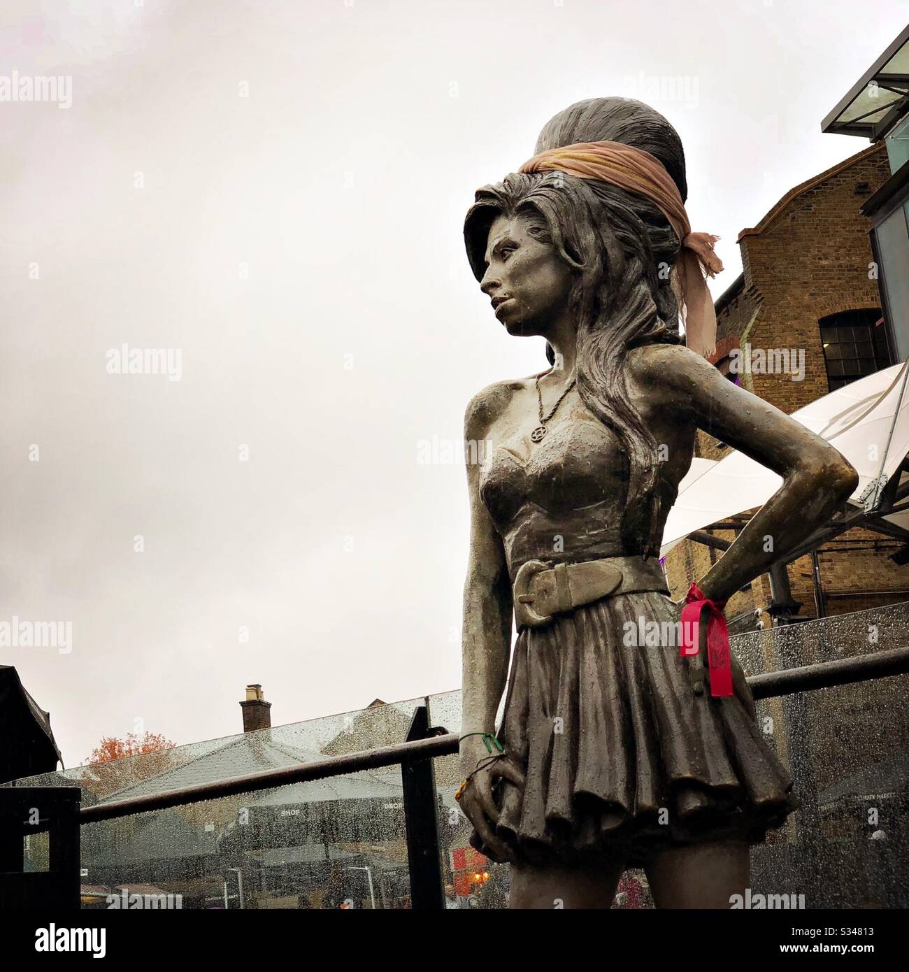 Bronze statue of British singer Amy Winehouse in Stables Market, Camden Town, London - Smartphone Captured Stock Image