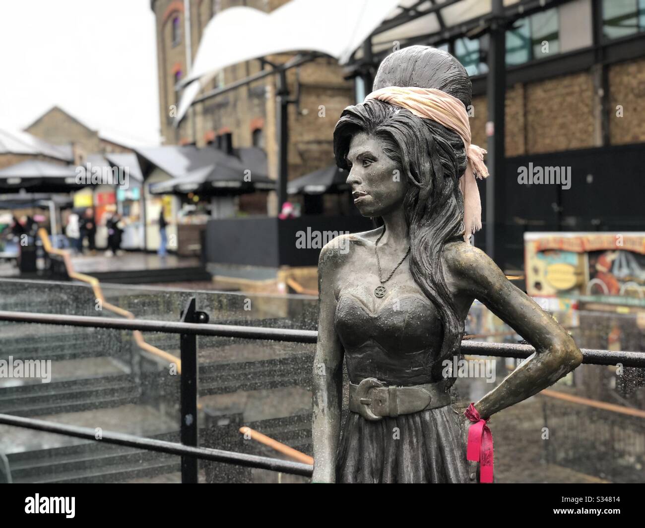 Bronze statue of British singer Amy Winehouse in Stables Market, Camden Town, London - Smartphone Captured Stock Image