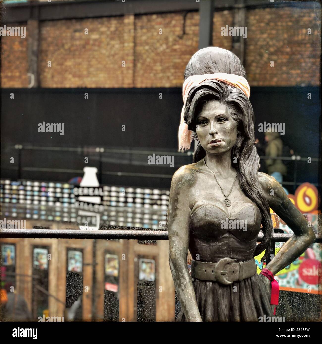 Bronze memorial statue of British singer Amy Winehouse at Stables Market, Camden Town, London - Smartphone Captured Stock Image