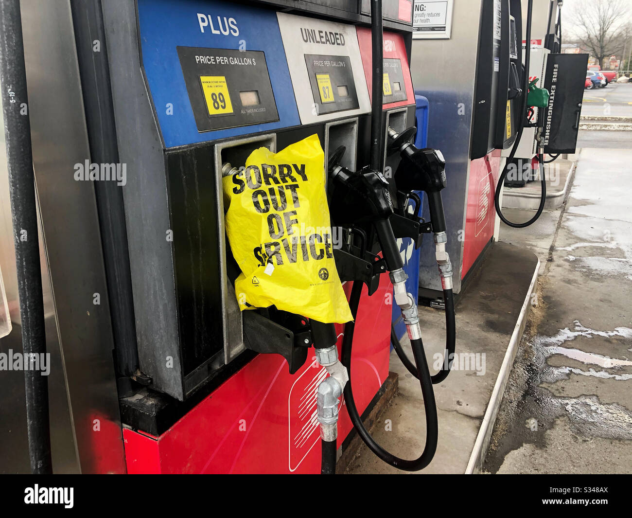 Gas station with limited supply of gasoline, fewer gas pumps available - Smartphone Captured Stock Image