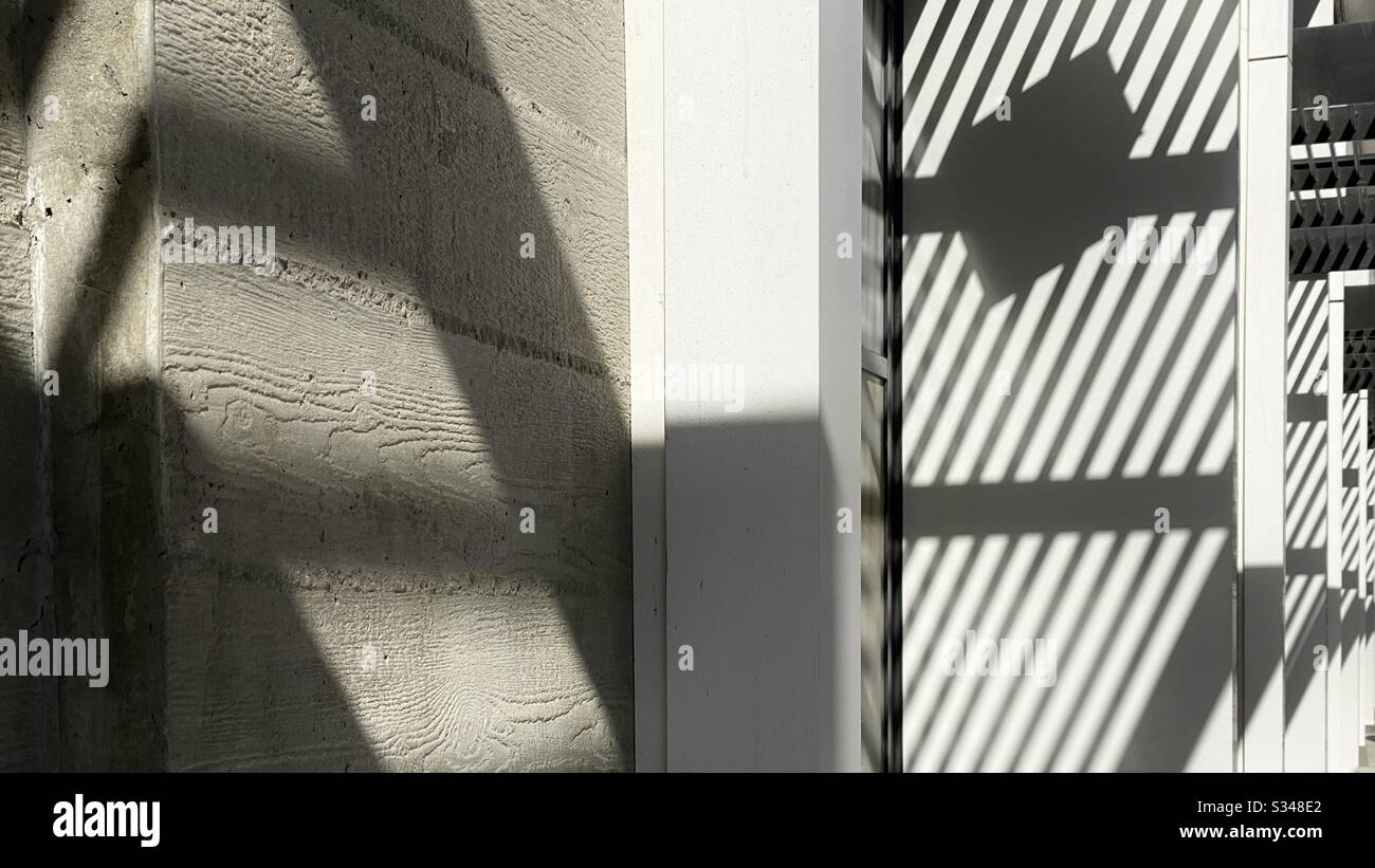 Abstract pattern created by shadows on exterior concrete walls - Smartphone Captured Stock Image