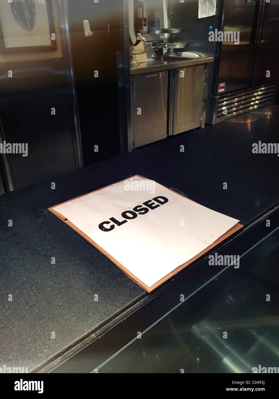 Small business store shut down to prevent spread of the coronavirus during the worldwide pandemic, March 2020, NYC, USA - Smartphone Captured Stock Image