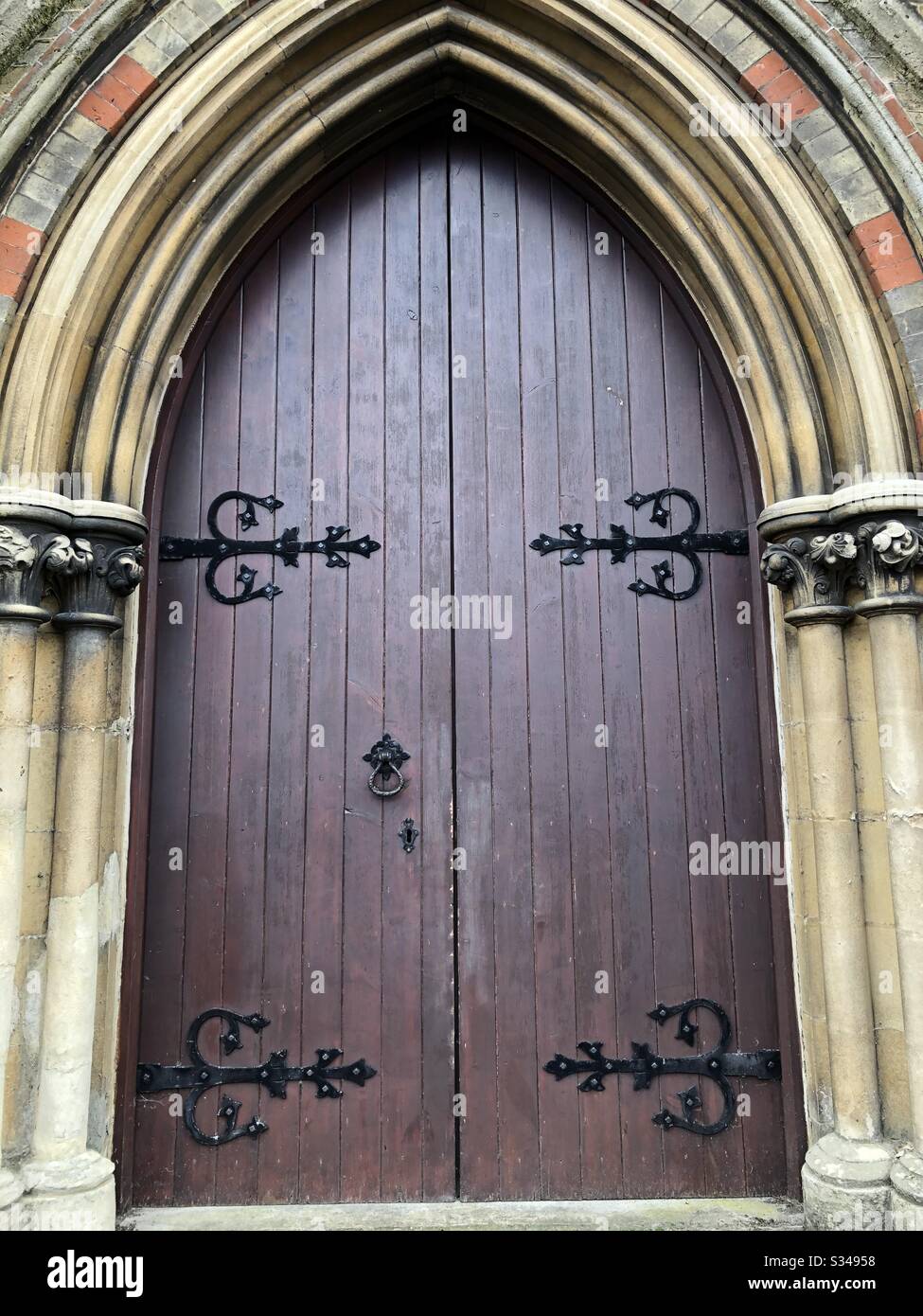 Church Doors in Gothic Arch Stock Photo Alamy