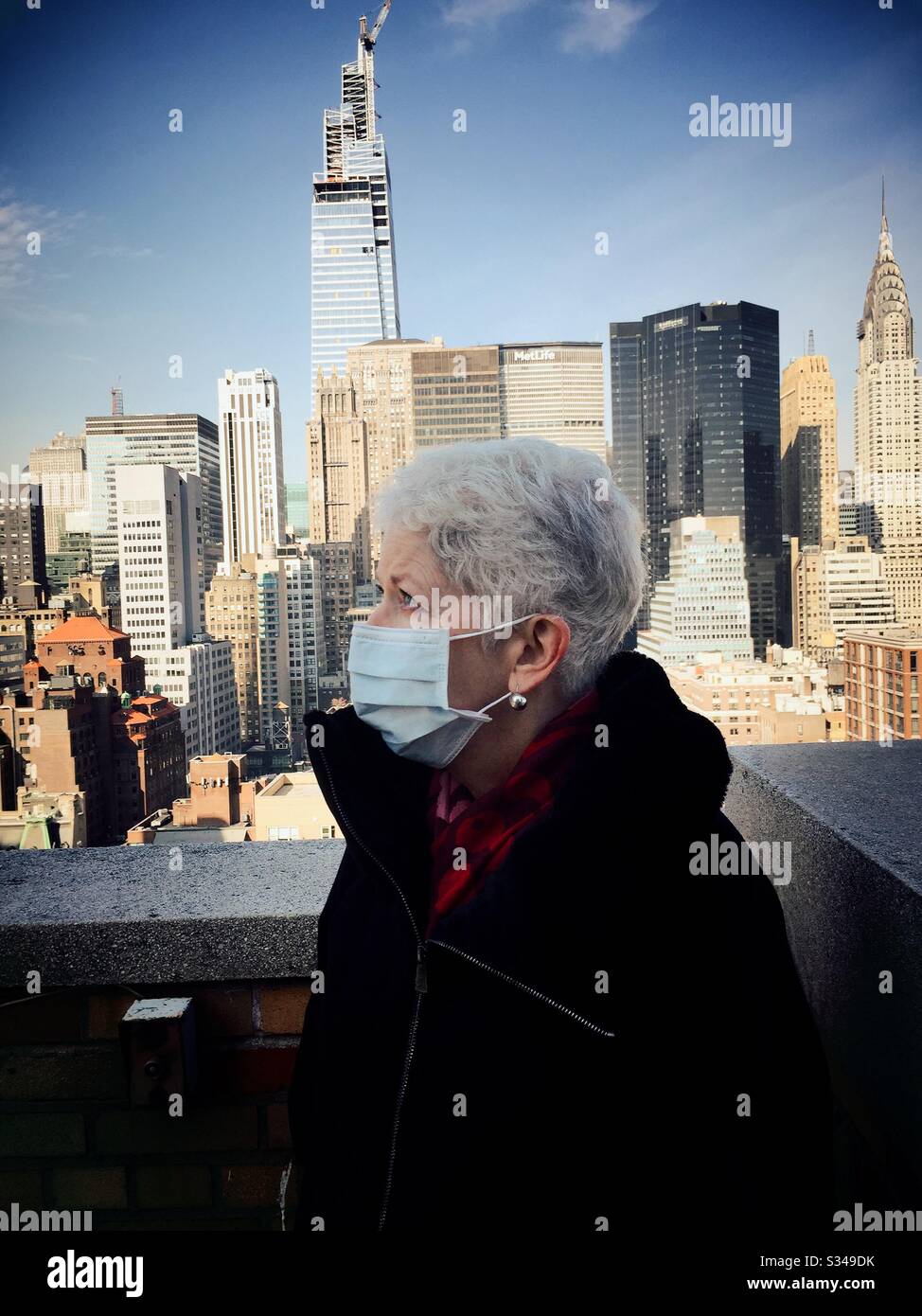NYC Covid-19, Elderly woman wearing a protective mask to combat the spread of germs during the outbreak, USA - Smartphone Captured Stock Image