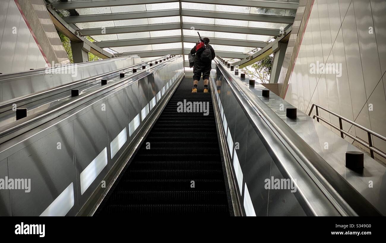 LOS ANGELES, CA, MAR 2020: man riding escalator up from Pershing Square Station on the LA Metro in Downtown - Smartphone Captured Stock Image